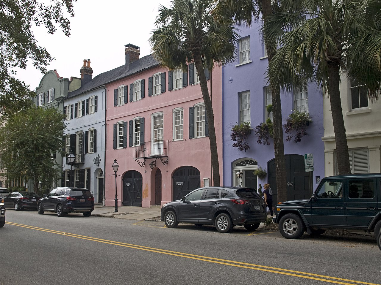 Pastel historic houses and palms on Rainbow Row in Charleston